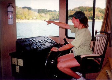 Picture of Kate in captain's chair, pointing